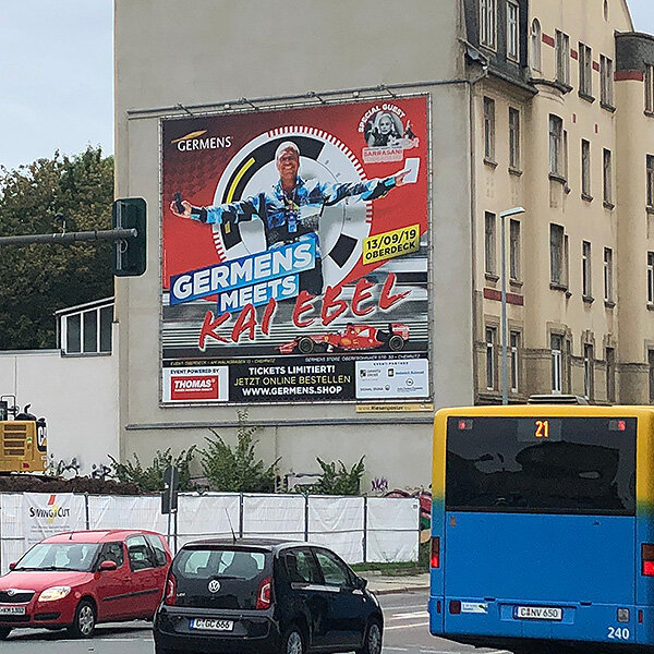PWC Plakatwerbung Chemnitz - Riesenposter von GERMENS artfashion mit dem Motiv von RTL Moderator Kai Ebel - Außenwerbung Standort HARTI